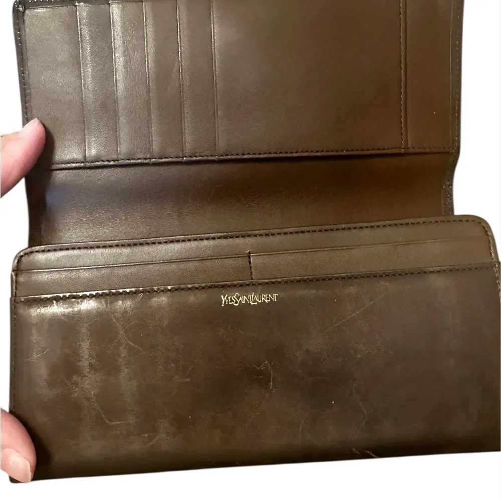Yves Saint Laurent Tan Leather Wallet with Gold Clasp with marks and scratches.